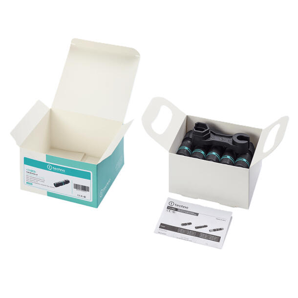 Techno-liitinsarja mustine sähköliittimineen ja turkooseine tiivisterenkaineen avatussa pakkauksessa käyttöohjeen kanssa